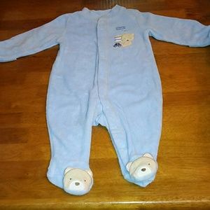 Adorable teddy bear on piece jammies