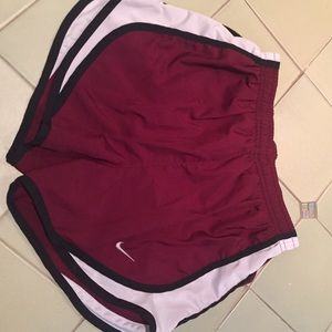 Burgundy and white Nike dri-fit athletic shorts
