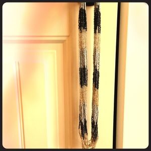 Black, silver and gold multi-strand necklace