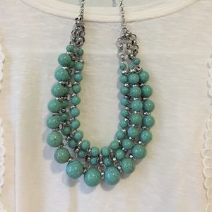 Turquoise and silver necklace.