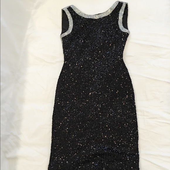 A black open back sequin dress
