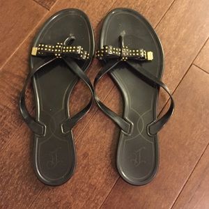Black jelly Ivanka Trump flip flops
