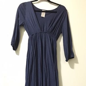 Sparkly blue midi dress with low v-neck line.