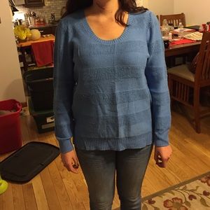 Blue knit sweater.
