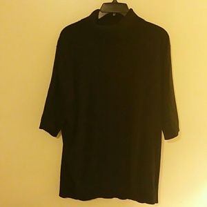Short sleeved black turtleneck sweater.