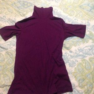 A purple turtle neck shirt
