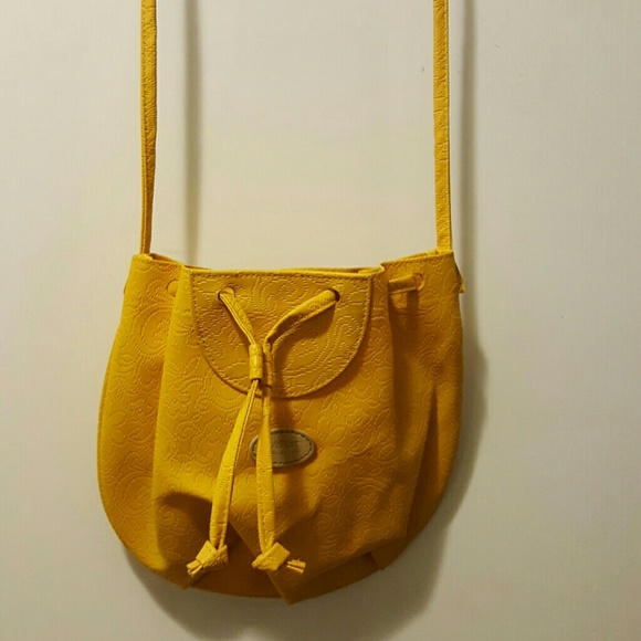 Yellow long strapped purse.
