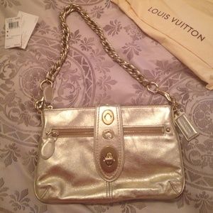 Gold leather Coach clutch or shoulder bag purse