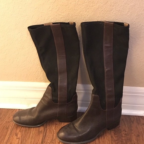 Brown and black leather riding boots.