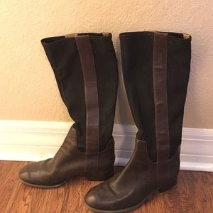 Brown and black leather riding boots.