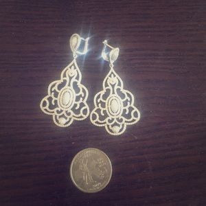 Sterling silver with cubic zirconia stones.