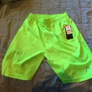 Head. Green athletic shorts