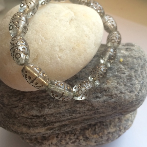 Cute clear bracelet with gold tribal design