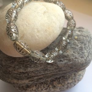 Cute clear bracelet with gold tribal design