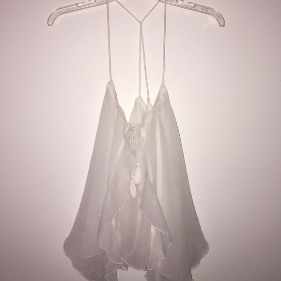 Light, cute back top. FITS LIKE A MEDIUM.