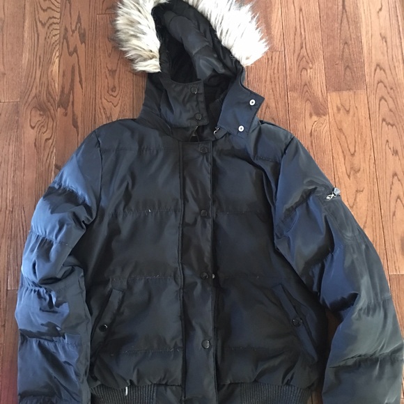 Black down winter jacket, with a fur hood.