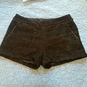 Shiny black mini shorts