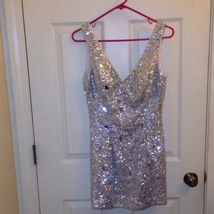 Small silver rhinestone covered cocktail dress.
