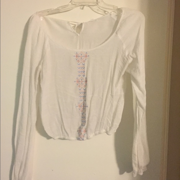 Long sleeve shirt/crop top with Aztec design.