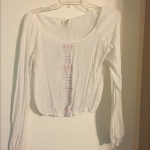 Long sleeve shirt/crop top with Aztec design.