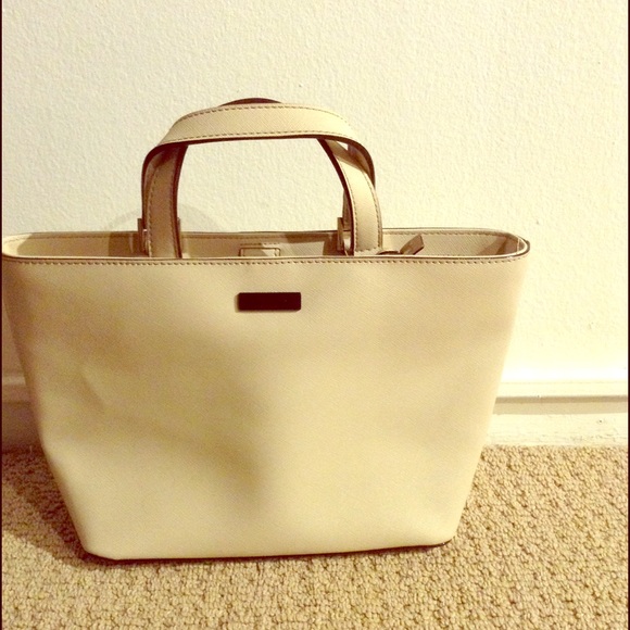 Brand new kate spade ivory bag. Never been used.