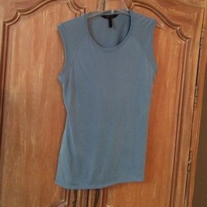 Aqua sleeveless top. Half moon opening in back.