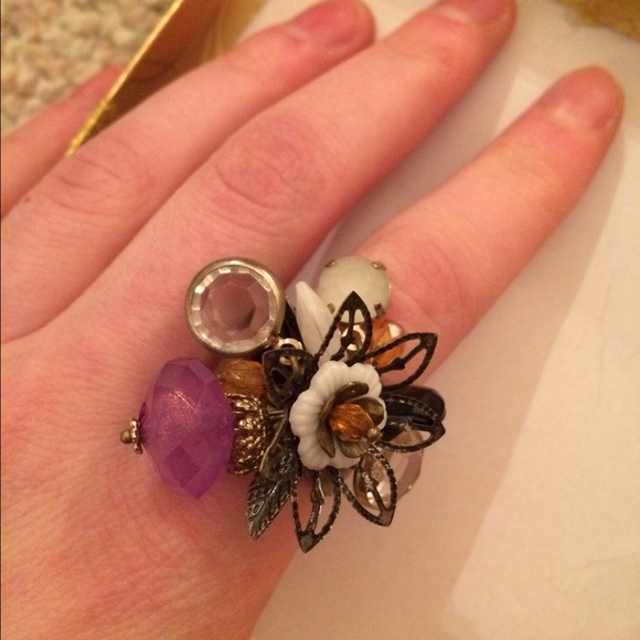 Ring with gems and flowers hanging