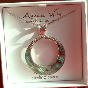 Shiny and new turquoise pendant necklace.