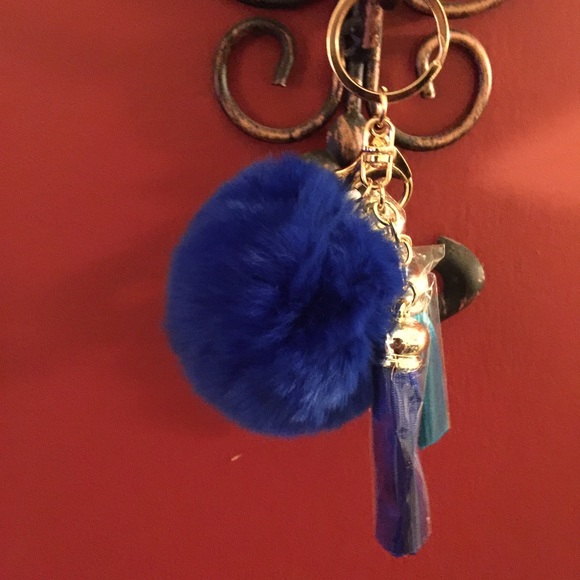 vibrant cobalt blue fur ball key ring with tassels