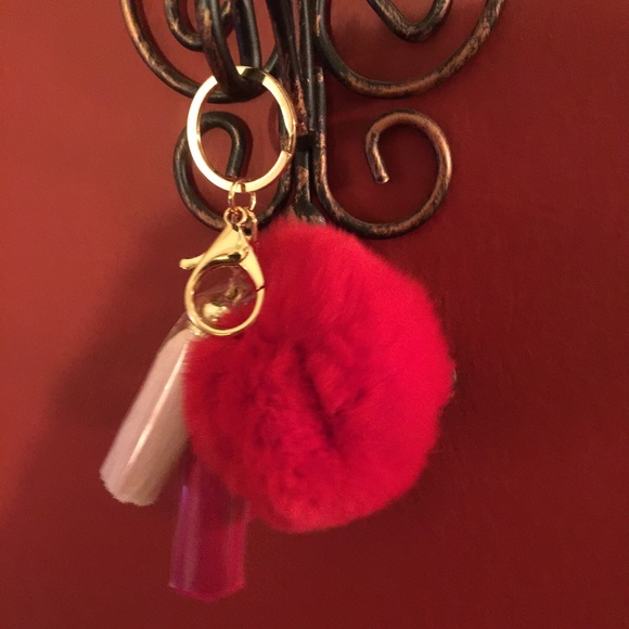 vibrant red fur ball key ring with tassels
