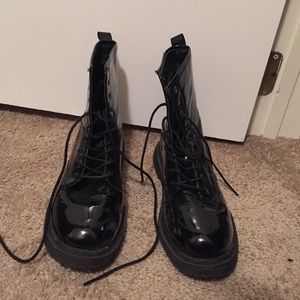 Shiny black combat boots