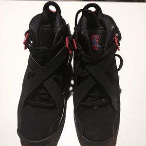 Black Jordan sneakers with blue & pink highlights