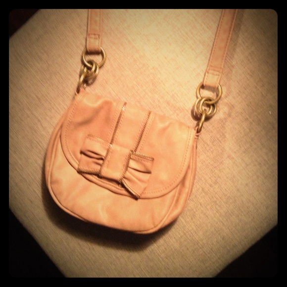 Light pink cross body purse with zipper bow