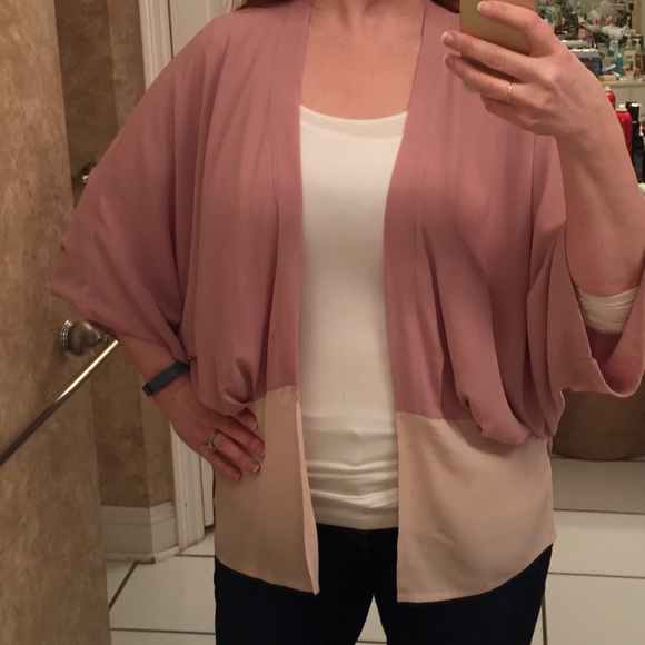 Pink/mauve shrug style cover