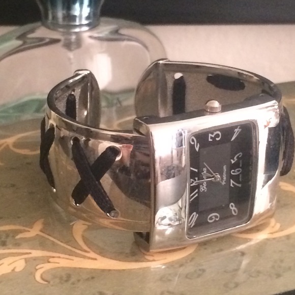 Silver watch with ribbon decorations