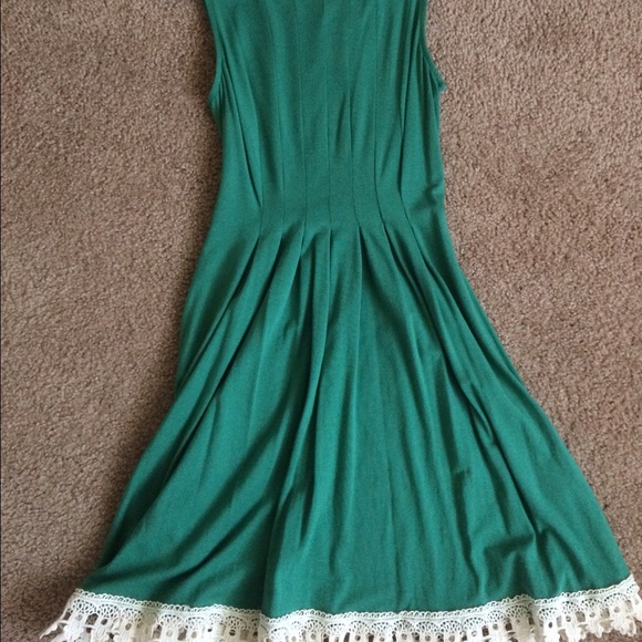 Green dress with white lace trim