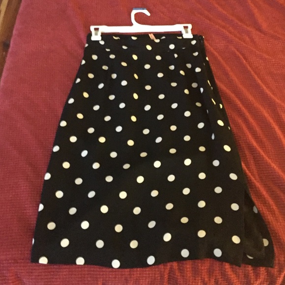 Black skirt with cream polka dots.