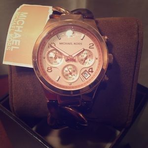 Rose gold and tortoise Michael Kors watch.