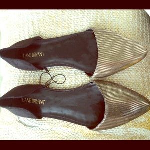 Gold and black pointed flats.