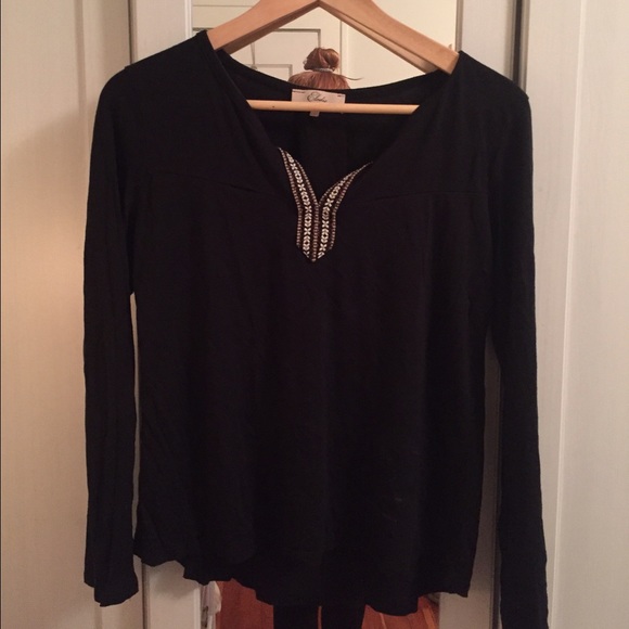 Long sleeve black shirt with tribal detail