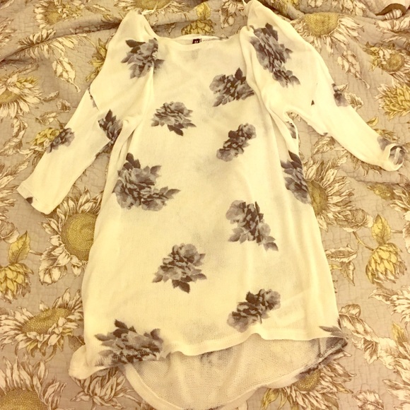 White sweater with gray floral print