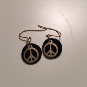 Dangling peace sign earnings.