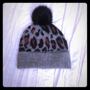 Super cute winter hat with black pompon on top