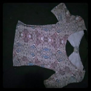 A crop top, open back, and size small