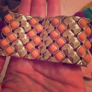 Bangle with coral on gold.