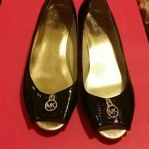 Michael Kors flats with an inch heel.