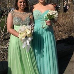 Green dress on the left. Worn once