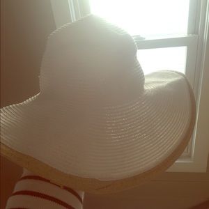 White and tan wide brim floppy hat