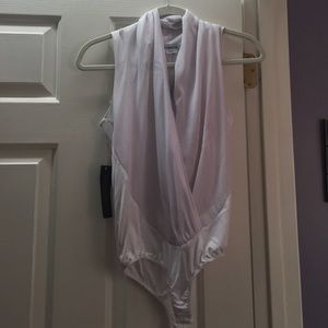 Bebe luxurious silk body suit never worn