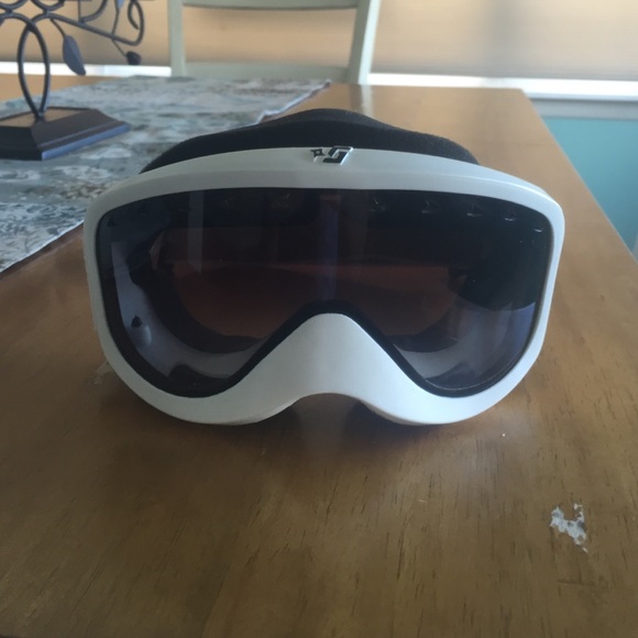 White framed tinted ski goggles